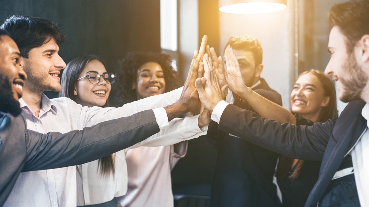 diverse-group-of-employees-high-fiving